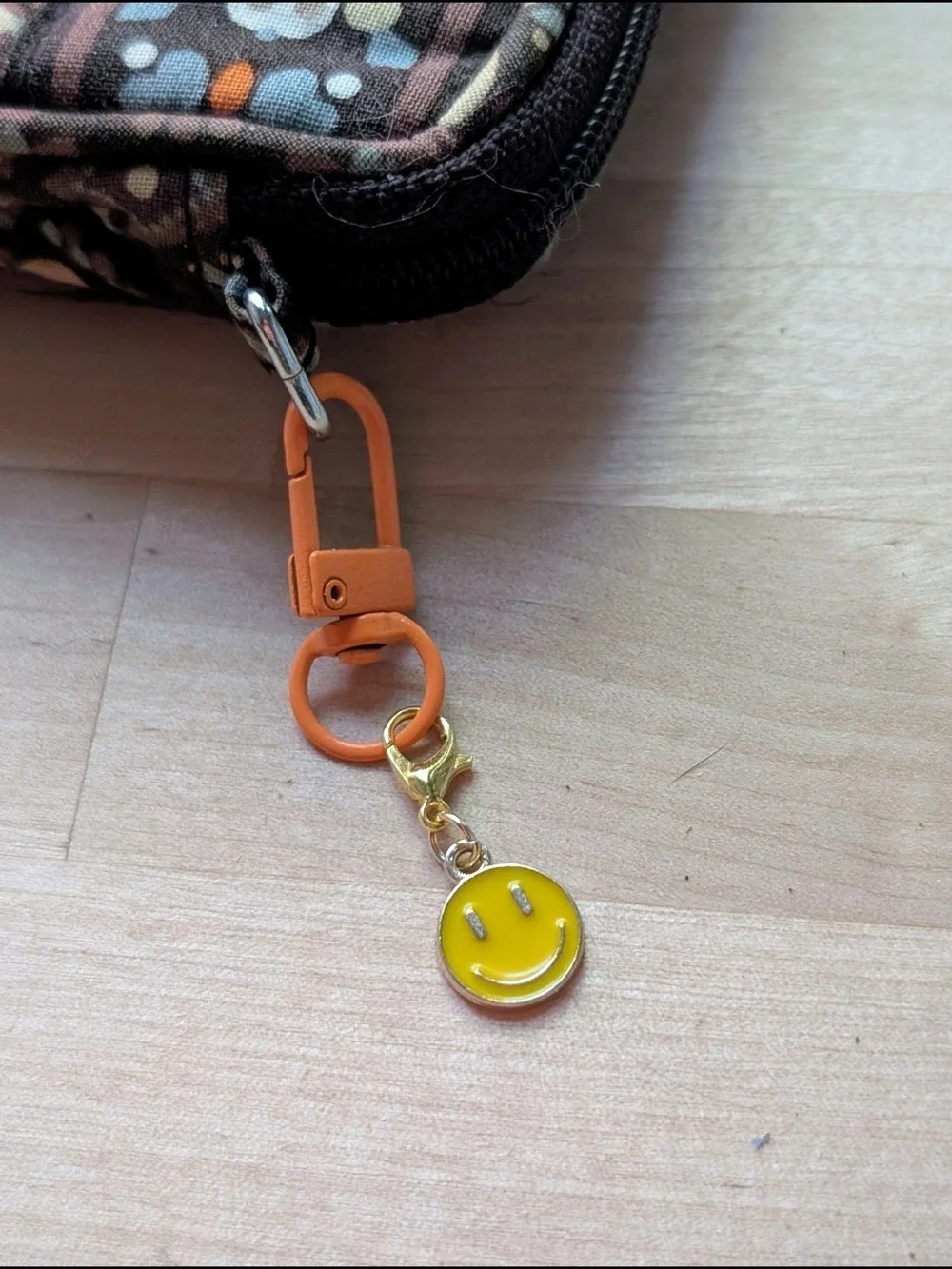Orange Clip Keychain with Yellow Smiley Charm